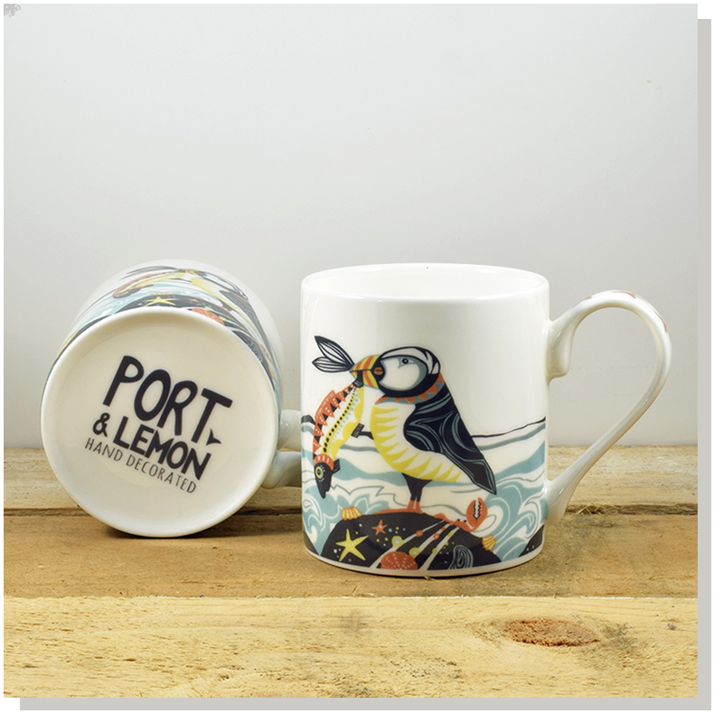 hand painted puffin design on a bone china mug